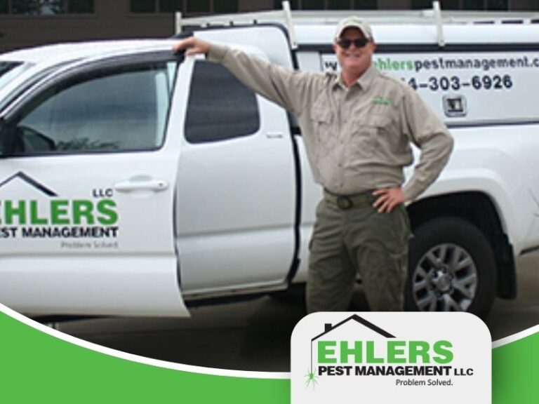 John Ehlers poses in front of his Ehlers Pest Managament Truck, a proud veteran-owned business owner.